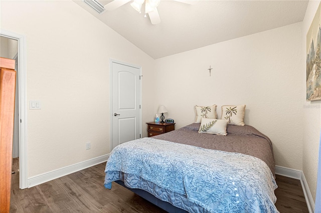 bedroom with lofted ceiling, dark hardwood / wood-style floors, and ceiling fan