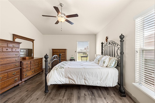 bedroom with vaulted ceiling, dark hardwood / wood-style floors, and ceiling fan