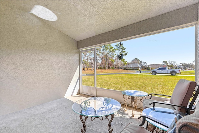 sunroom with vaulted ceiling