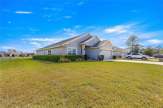 view of front of property with a garage and a front lawn