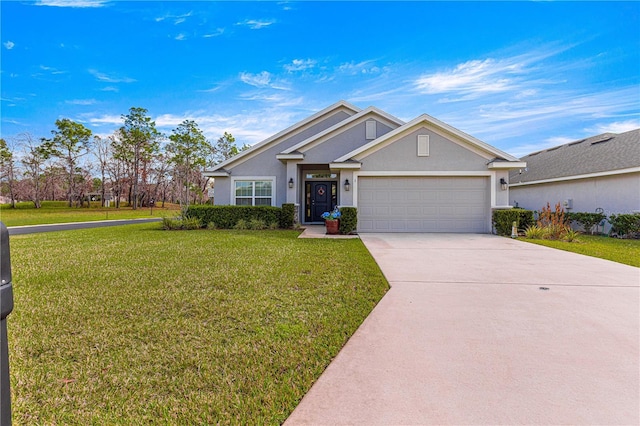 view of front of house with a garage and a front yard