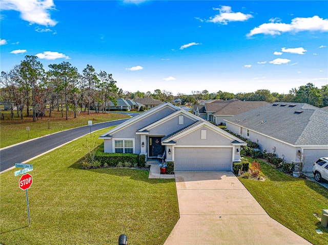 view of front facade with a garage and a front yard