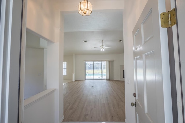 corridor featuring hardwood / wood-style flooring