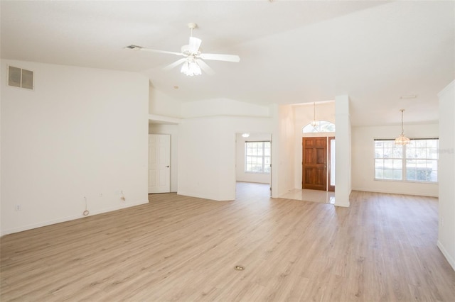 unfurnished living room featuring ceiling fan, vaulted ceiling, and light wood-type flooring