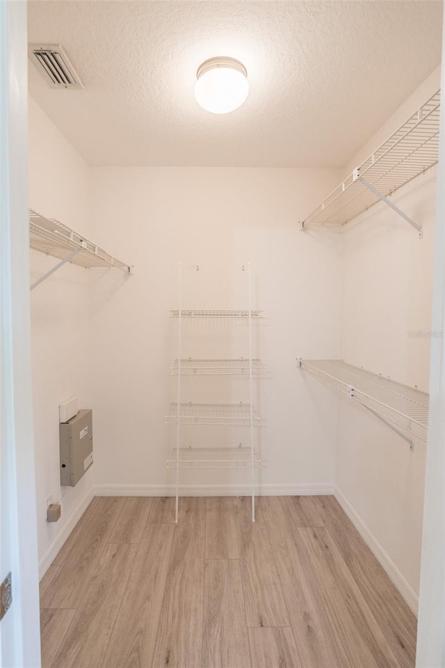 walk in closet featuring light wood-type flooring