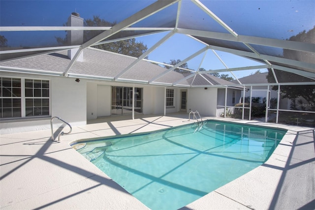 view of pool featuring a lanai and a patio