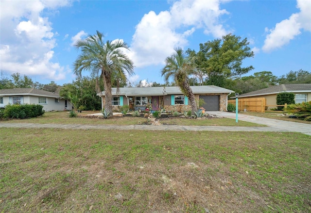 single story home with a garage and a front yard