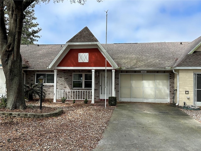 view of front of property featuring a garage and covered porch