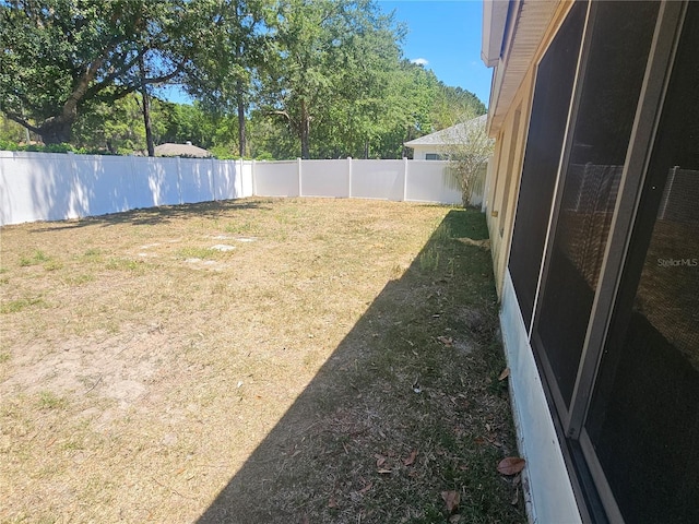 view of yard with a fenced backyard