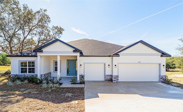 view of front of home featuring a garage and a porch