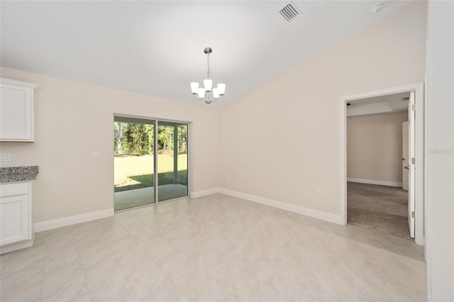 unfurnished dining area featuring lofted ceiling and an inviting chandelier