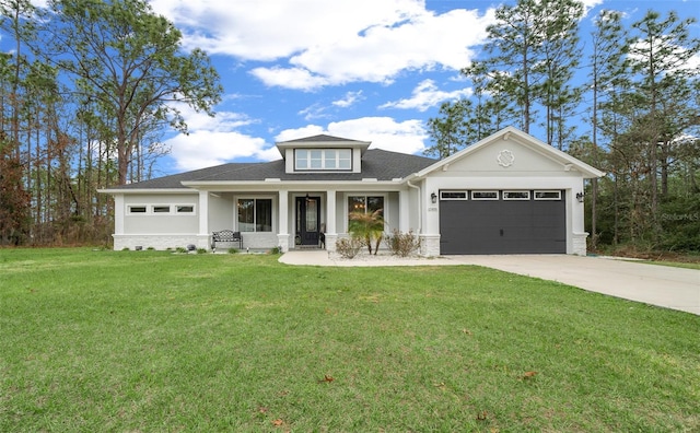 view of front of home with a garage and a front lawn