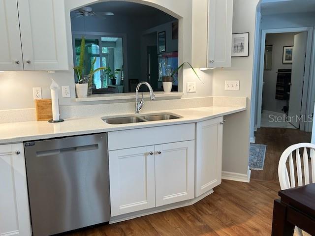 kitchen with sink, dishwasher, ceiling fan, white cabinets, and dark hardwood / wood-style flooring