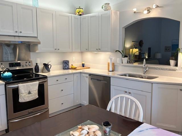 kitchen with white cabinetry, appliances with stainless steel finishes, and sink