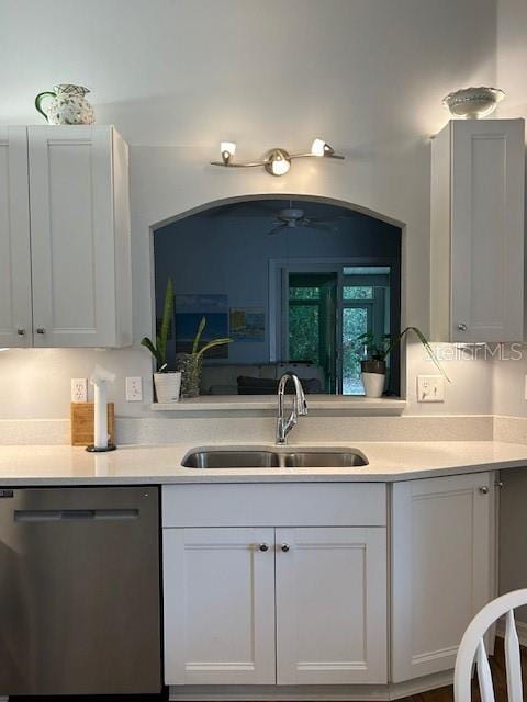 kitchen with dishwasher, sink, white cabinets, and ceiling fan