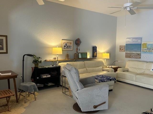 living room featuring light carpet and ceiling fan