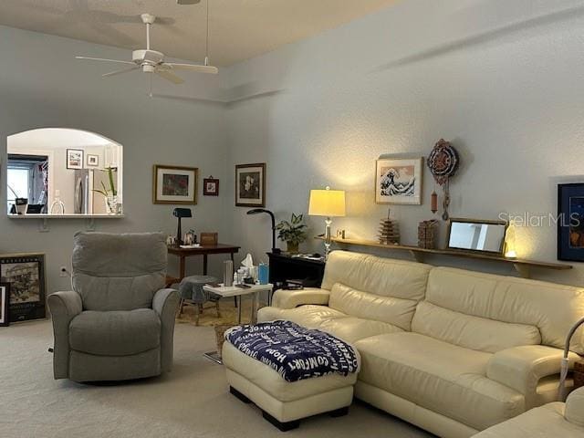 living room featuring carpet floors and ceiling fan