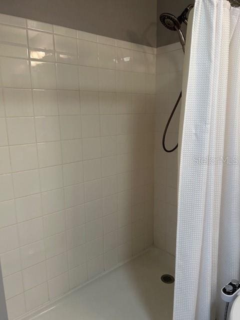 bathroom with a shower with curtain