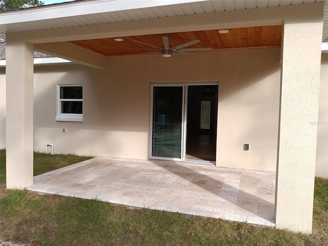 view of patio featuring ceiling fan