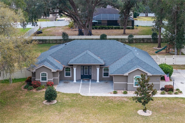 single story home featuring a front yard and a patio