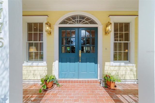 view of exterior entry featuring french doors