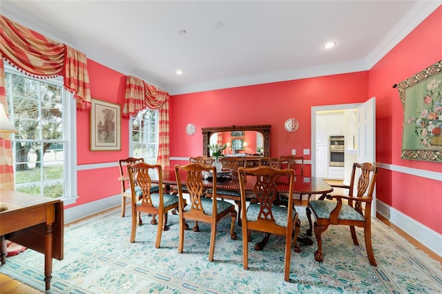 dining space with crown molding