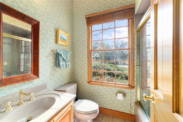 full bathroom with vanity, tile patterned floors, shower / bath combination with glass door, and toilet