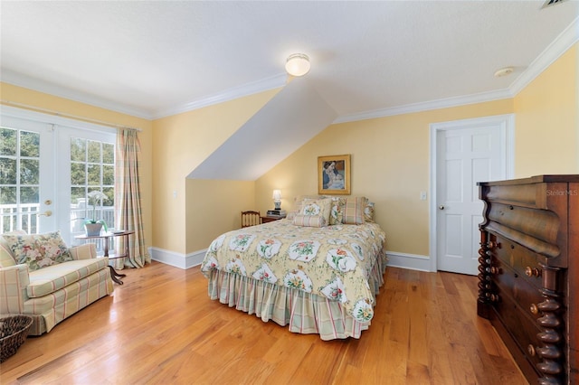 bedroom with wood-type flooring, crown molding, and french doors