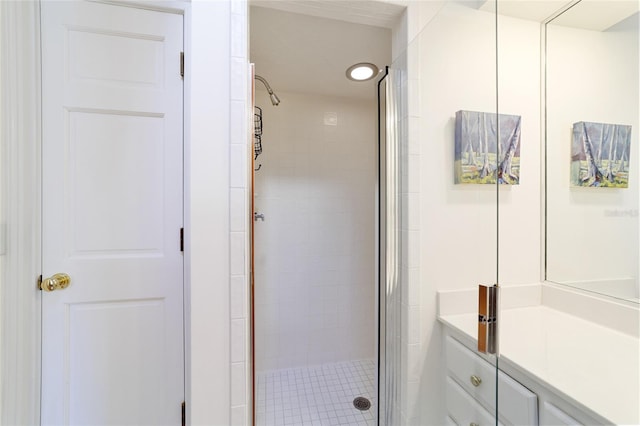 bathroom featuring a shower with shower door