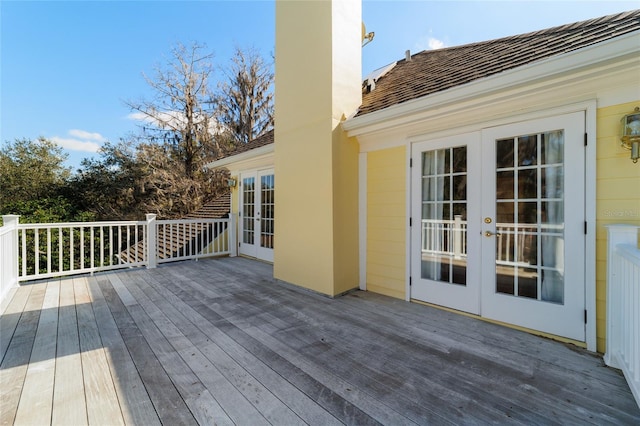 wooden deck featuring french doors