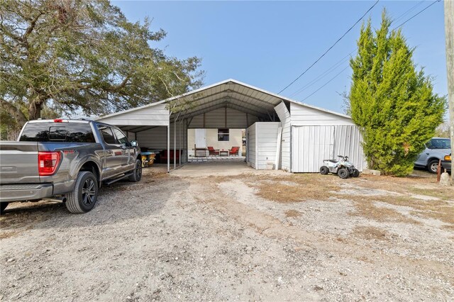 exterior space with a carport