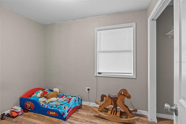 bedroom with wood-type flooring
