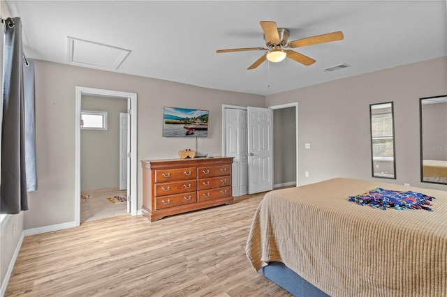 bedroom with ceiling fan, ensuite bath, and light hardwood / wood-style floors