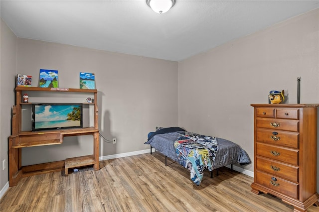 bedroom with light hardwood / wood-style flooring