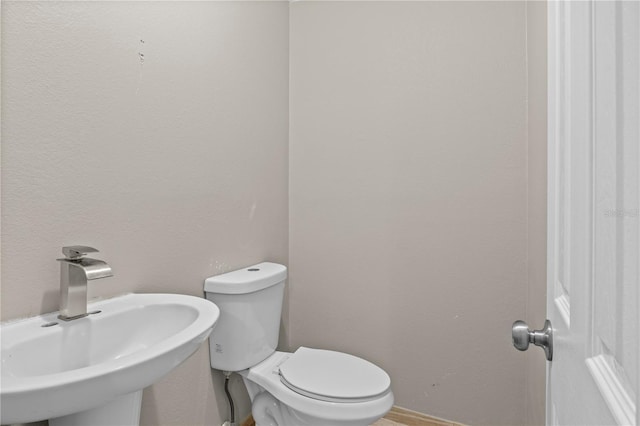 bathroom with sink and toilet