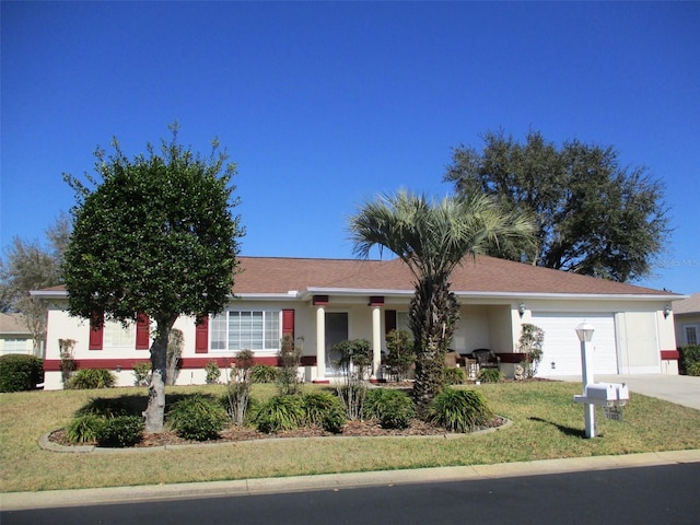 ranch-style home with a garage and a front yard