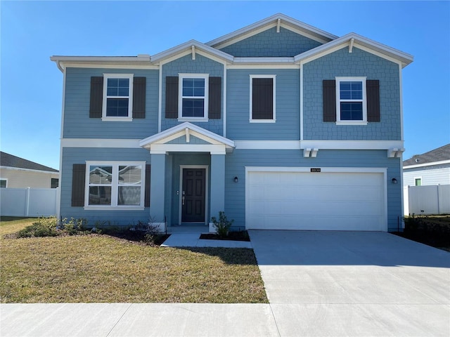 view of front of house featuring a garage and a front yard