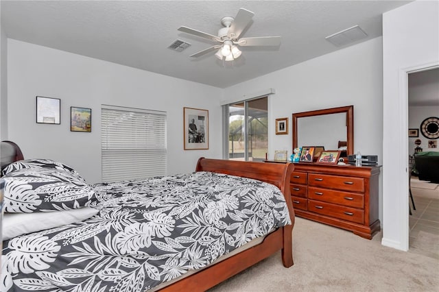 carpeted bedroom featuring ceiling fan, a textured ceiling, and access to outside