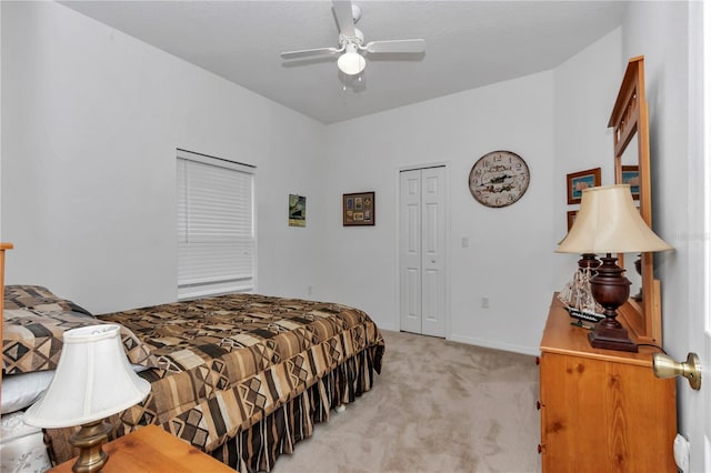 bedroom with light carpet, a closet, and ceiling fan