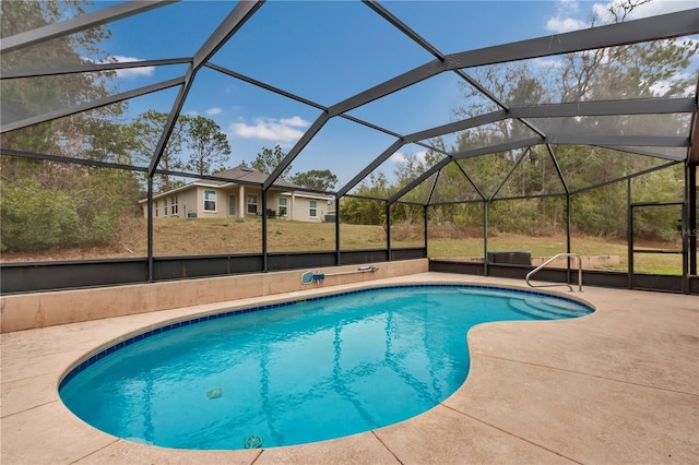 view of swimming pool with a patio area and glass enclosure