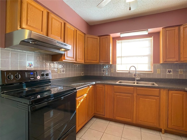 kitchen with light tile patterned floors, sink, black range with electric stovetop, backsplash, and a textured ceiling