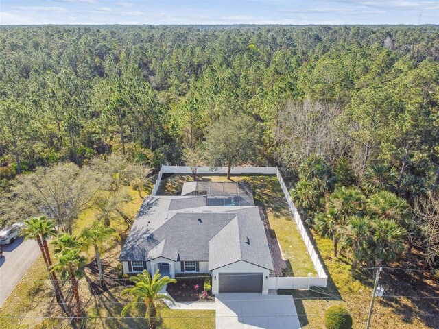 drone / aerial view with a view of trees