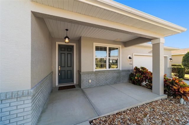 view of exterior entry featuring a garage