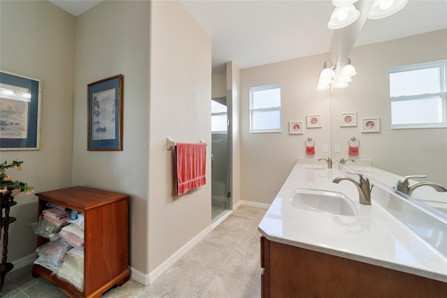 bathroom with vanity and a shower with shower door