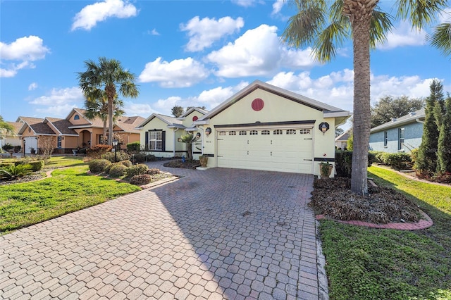 view of front of house featuring a garage and a front yard