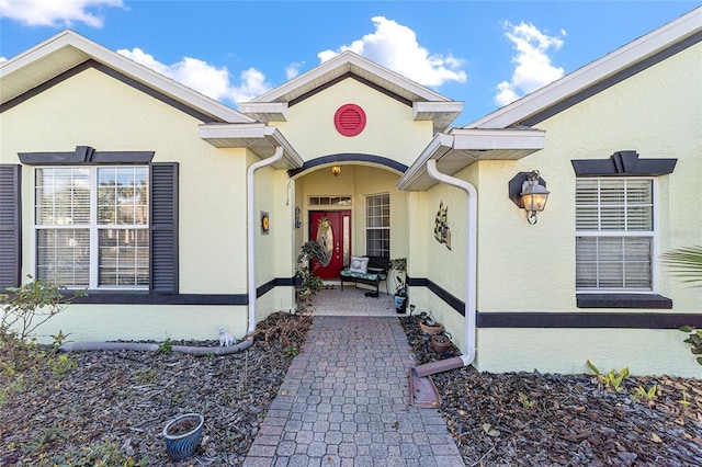 doorway to property with a patio area