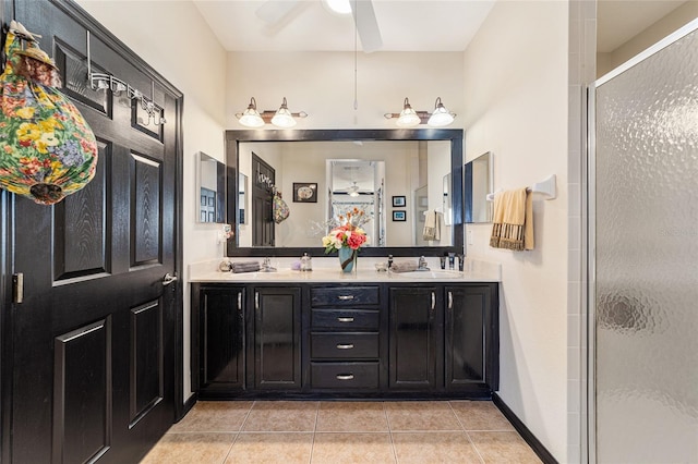 bathroom featuring walk in shower, ceiling fan, tile patterned floors, and vanity