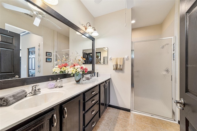 bathroom featuring a shower with shower door, tile patterned floors, and ceiling fan