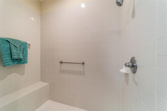 bathroom with a tile shower