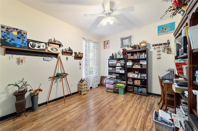 office area with ceiling fan and hardwood / wood-style floors